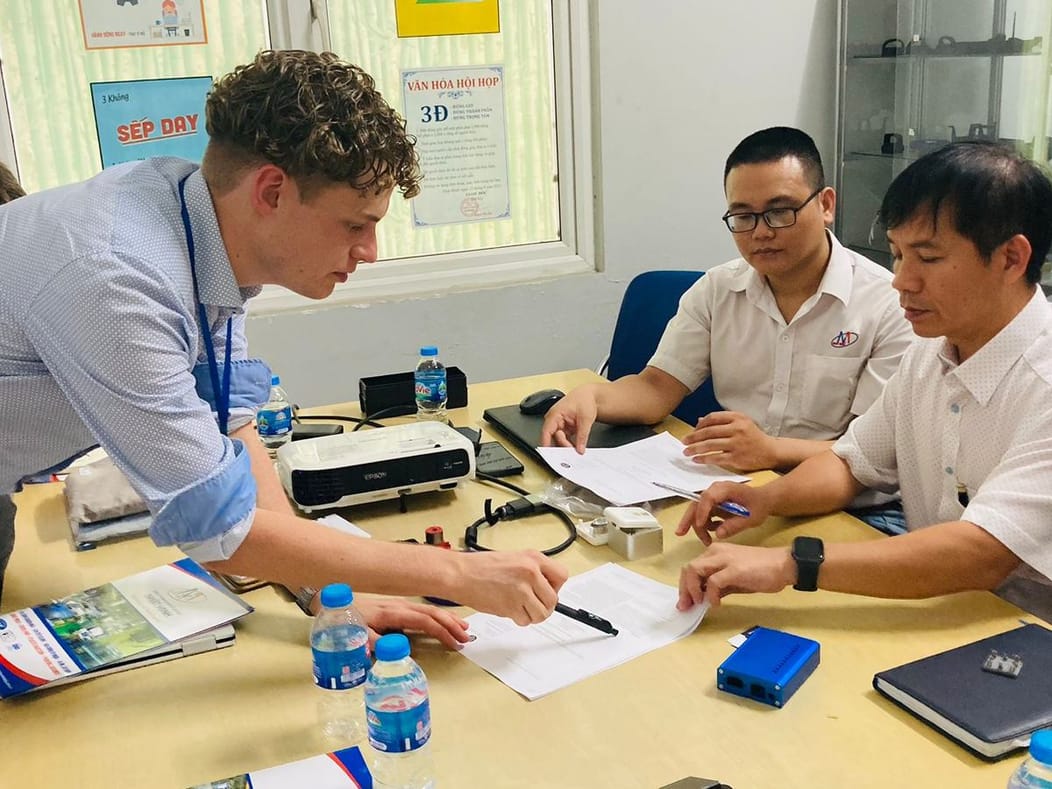 Attacan engineers going through drawings and documents with a manufacturing partner on site